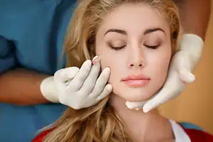 Dermatologist-Examines-A-Patient's-Face